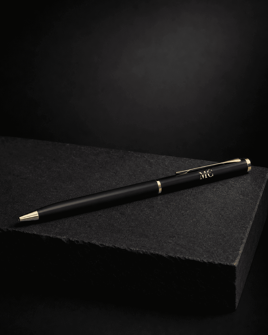 MČ pen on a black stone plinth